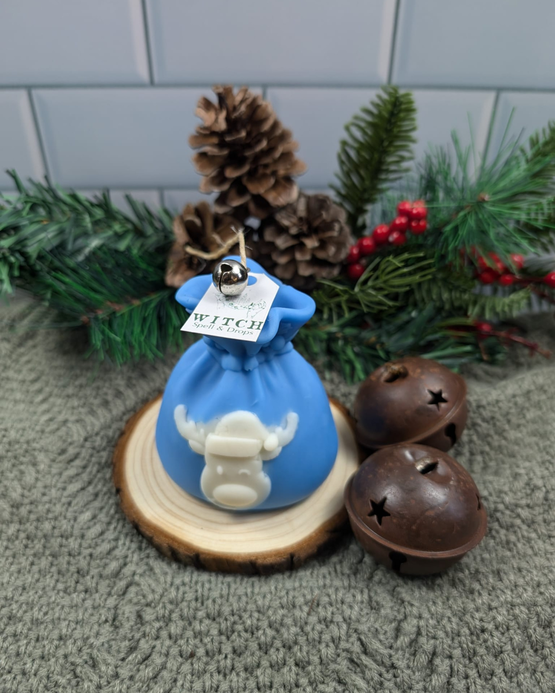 Candle Pillar of Santa Gift Bag with Rudolph face.